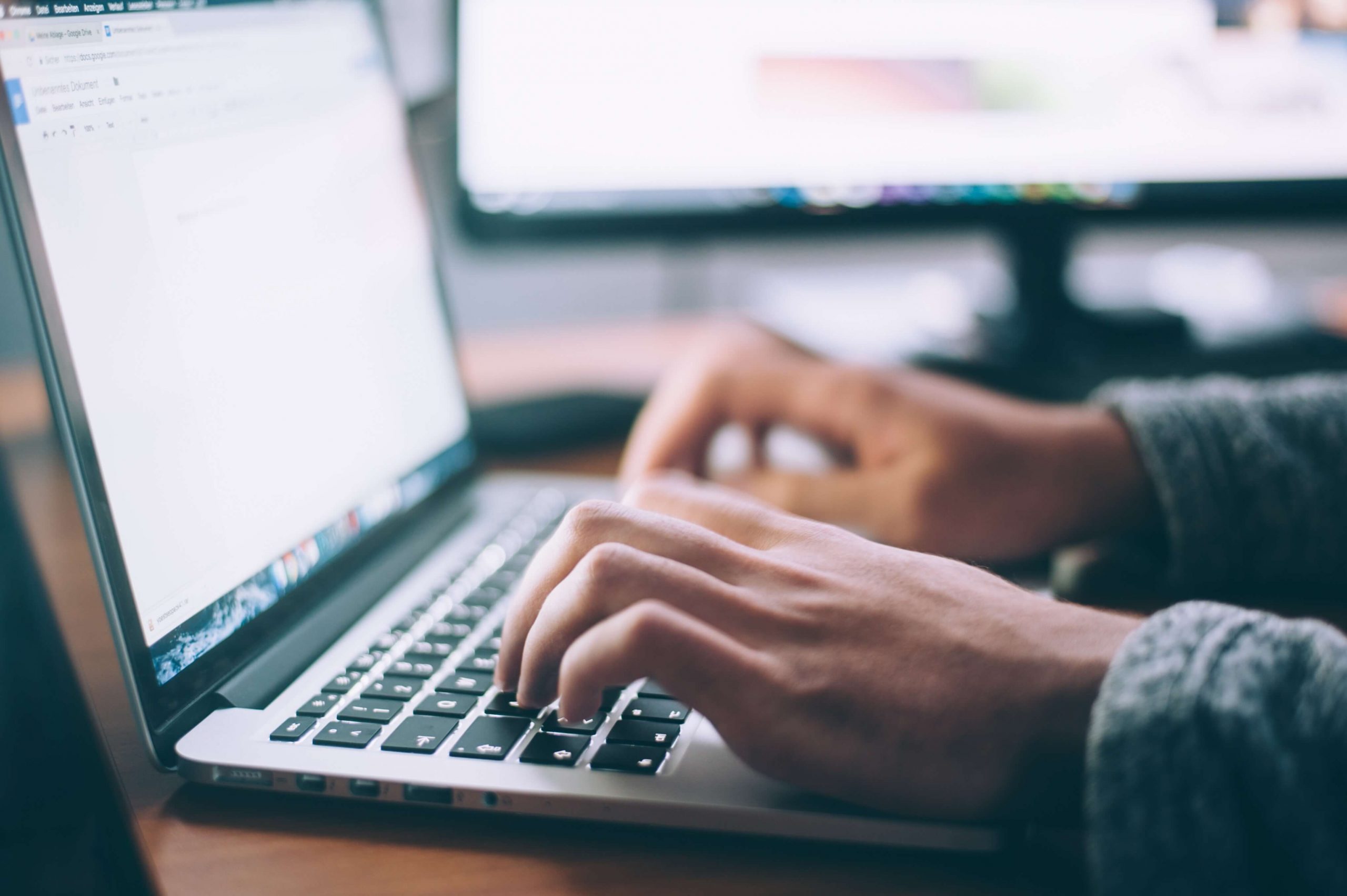 Man using laptop on broadband internet